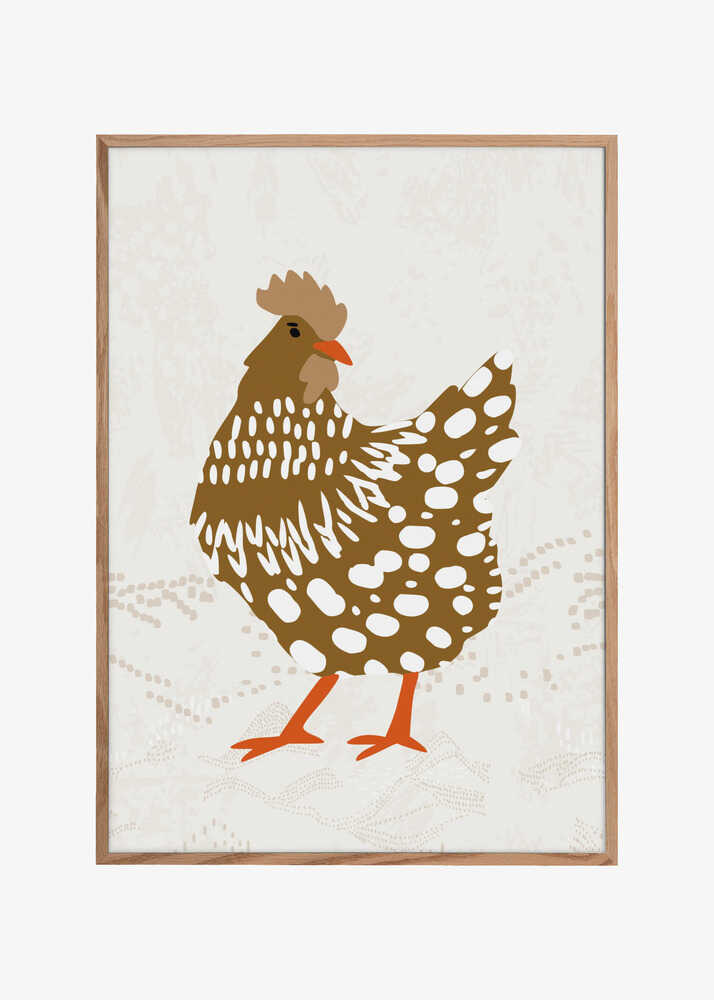 Brown hen on the grass