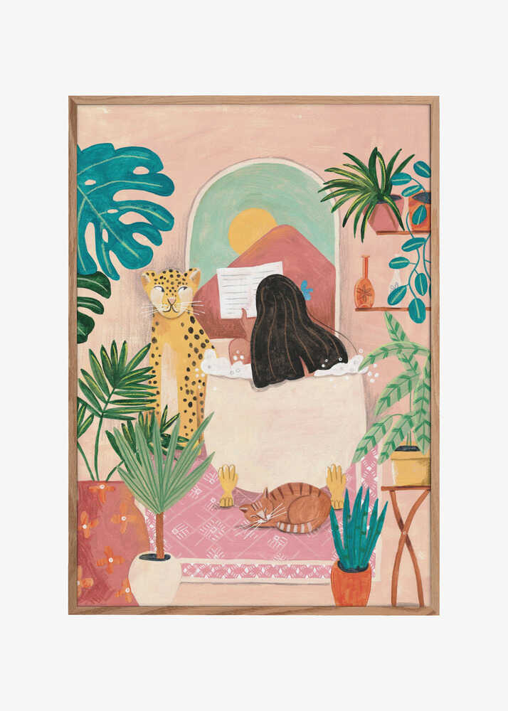 Woman taking bath in pink tropical bathroom