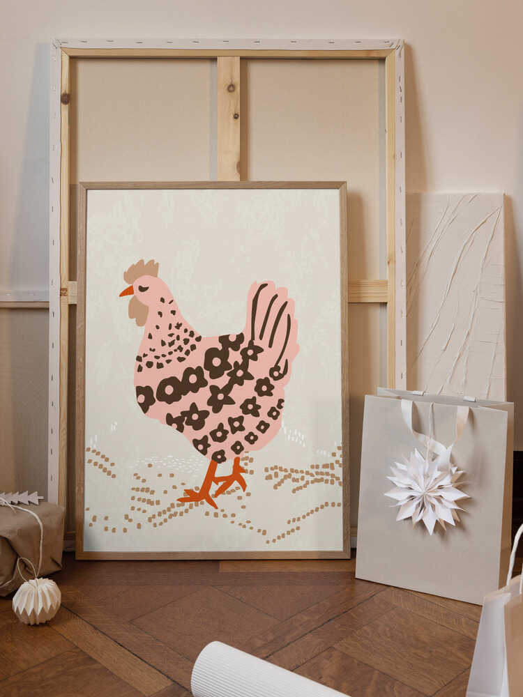 Pink hen on the grass