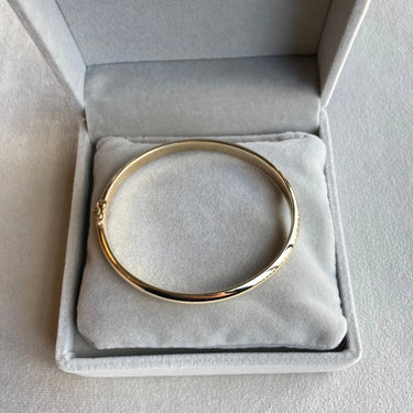 Klassisk armring 6,0/6,0 - 8 kt. Guld fra Gold Essentials by Plaza